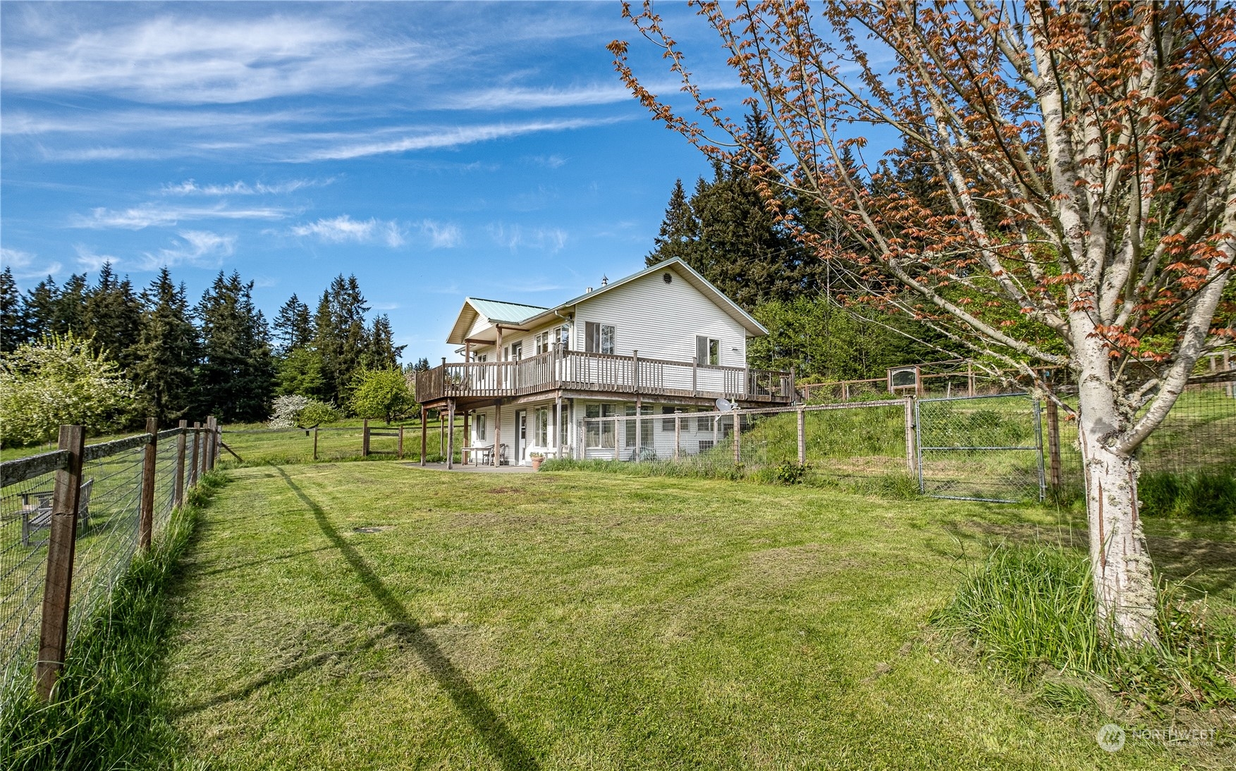 1750 Lancaster Road Freeland, WA 98249 - Photo 27 of 33 a view of a house with a yard