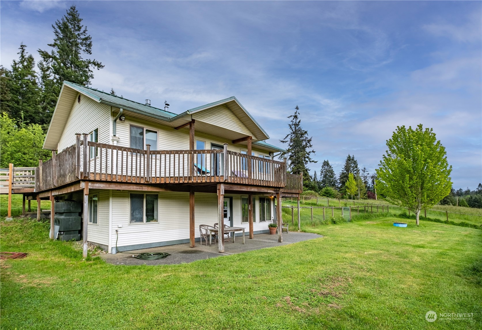 1750 Lancaster Road Freeland, WA 98249 - Photo 4 of 33 a view of a house with a yard porch and sitting area