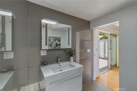 a white bath tub sitting next to a shower
