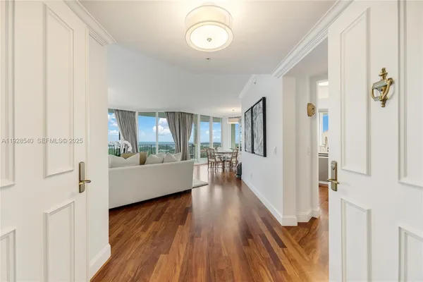 a view of a living room with hardwood floor