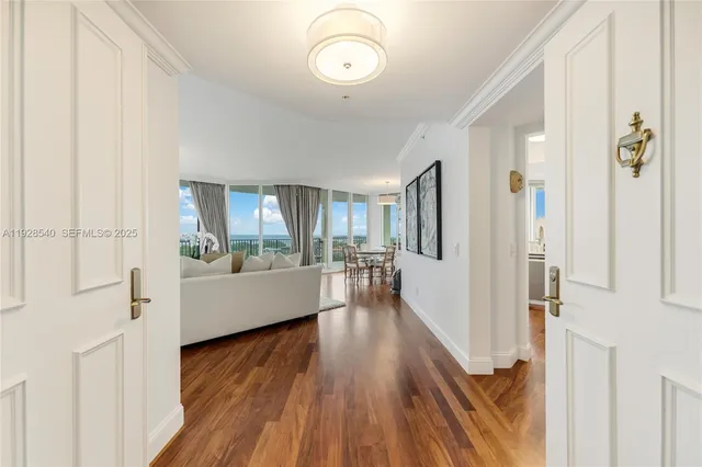 a view of a living room with hardwood floor