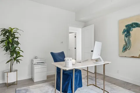 a view of a workspace with furniture