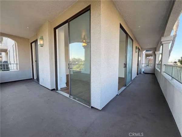 a view of a hallway with windows