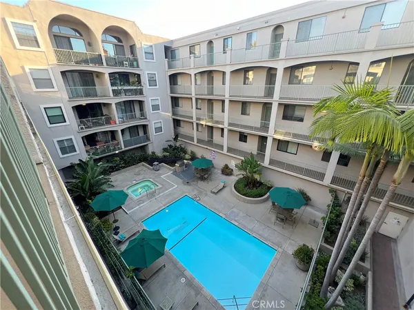 a view of balcony with furniture and potted plants