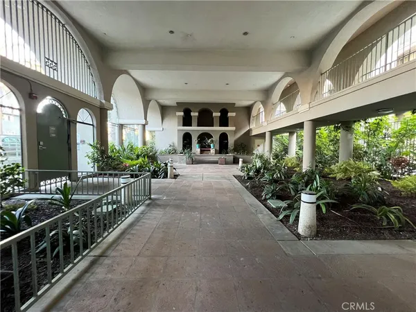 a view of a porch and potted plants
