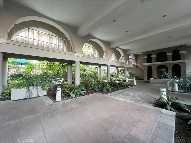 a front view of a building with garden