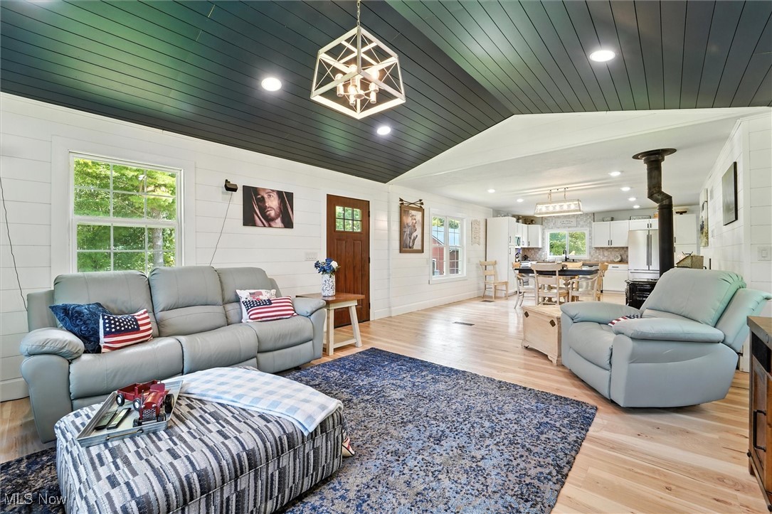3576 Plymouth Ridge Road Kingsville, OH 44048 - Photo 19 of 43 Living area featuring light wood finished floors, lofted ceiling, recessed lighting, a chandelier, and wooden ceiling