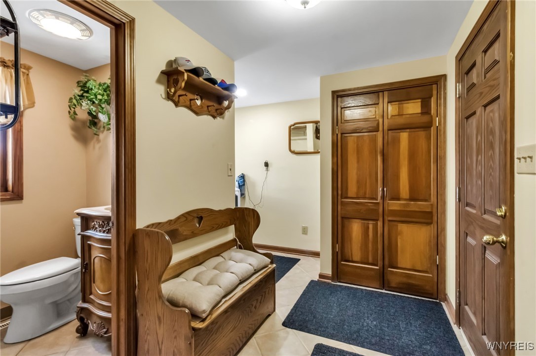 29 Brunck Road Lancaster, NY 14086 - Photo 20 of 49 Mudroom with coat closet and door to garage