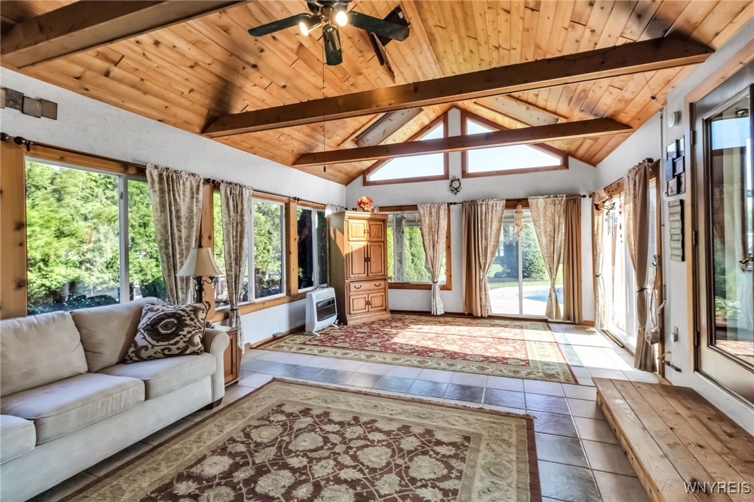 29 Brunck Road Lancaster, NY 14086 - Photo 26 of 49 Sunroom/family room with ceiling fan and roof fan