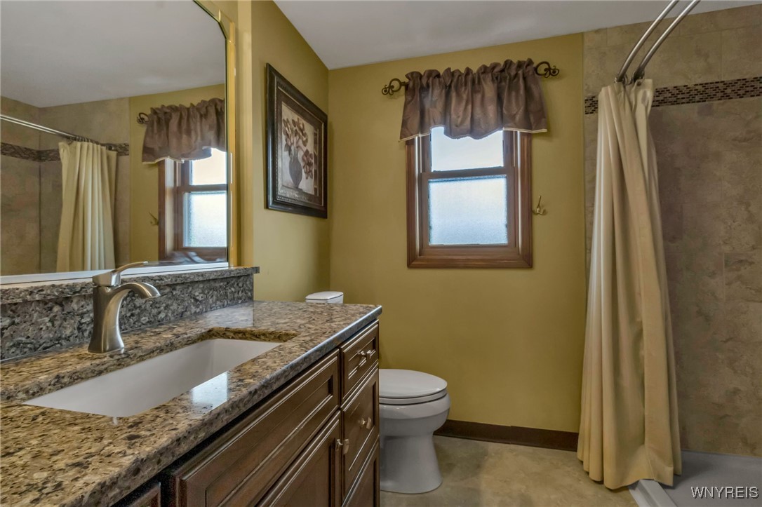 29 Brunck Road Lancaster, NY 14086 - Photo 33 of 49 Updated main bath w/granite vanity and tile walk-i