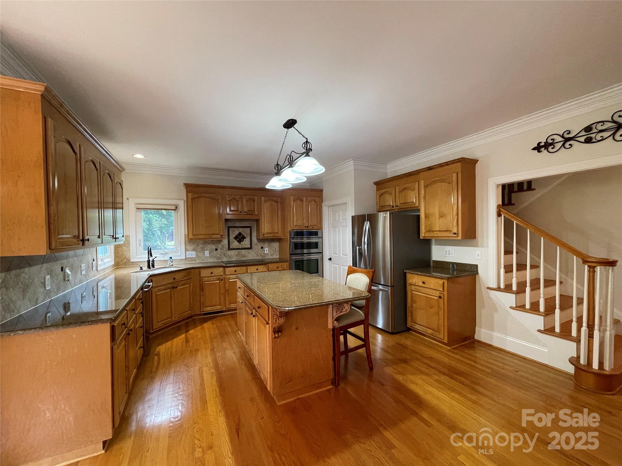 103 Berea Baptist Church Road Stanfield, NC 28163 - Photo 15 of 46 a large kitchen with a table and chairs
