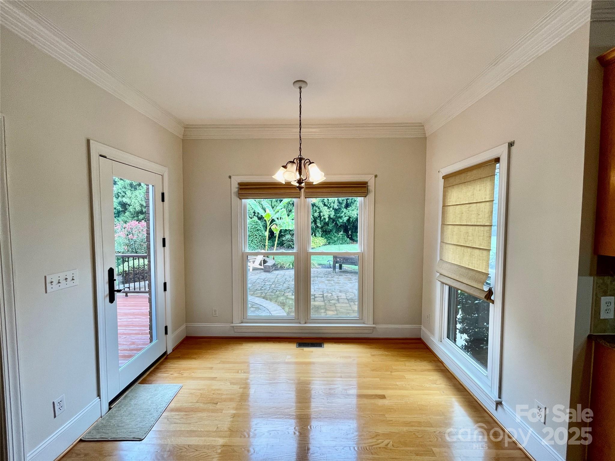 103 Berea Baptist Church Road Stanfield, NC 28163 - Photo 19 of 46 a view of an empty room with glass door and windows