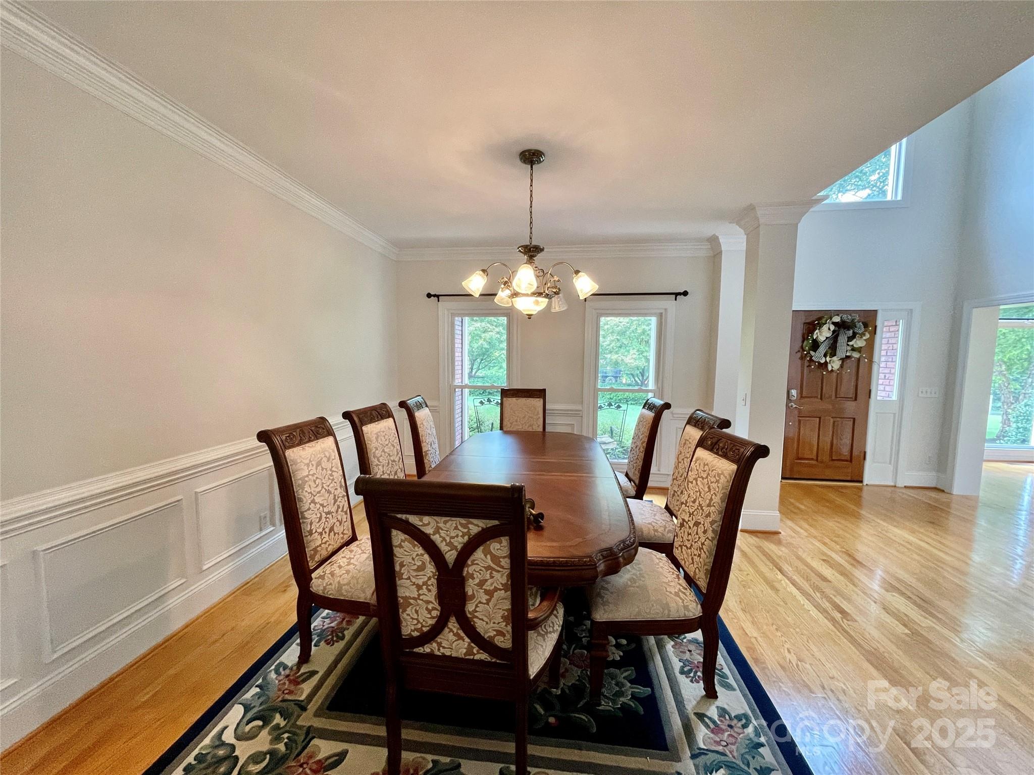103 Berea Baptist Church Road Stanfield, NC 28163 - Photo 22 of 46 a dining room with furniture a chandelier and wooden floor
