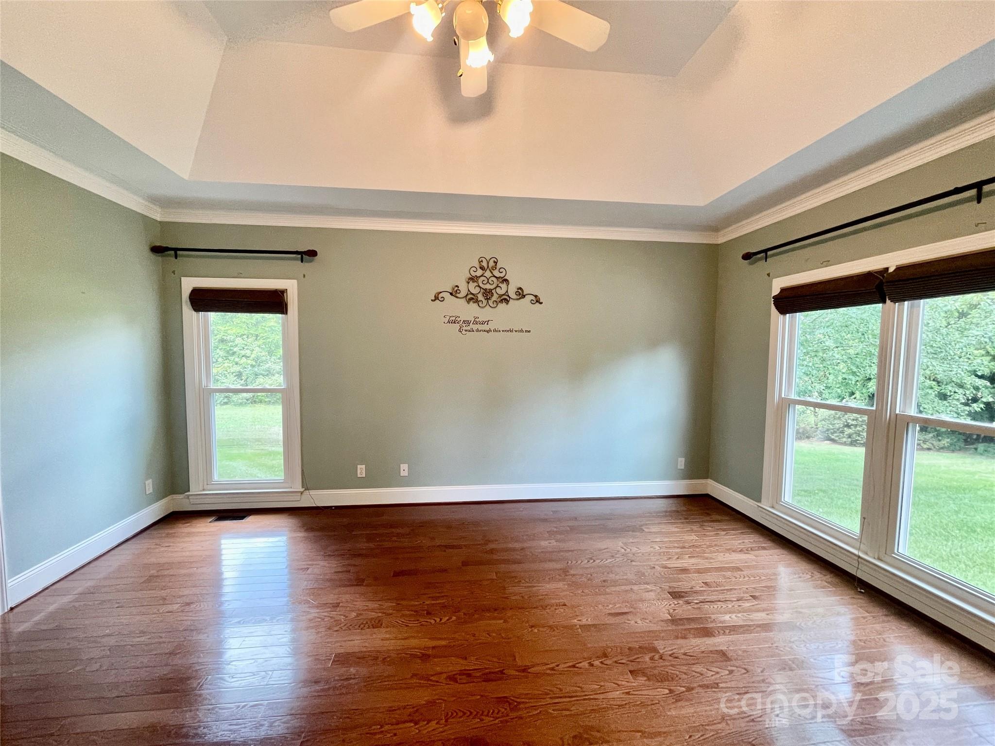 103 Berea Baptist Church Road Stanfield, NC 28163 - Photo 25 of 46 a view of empty room with wooden floor and fan