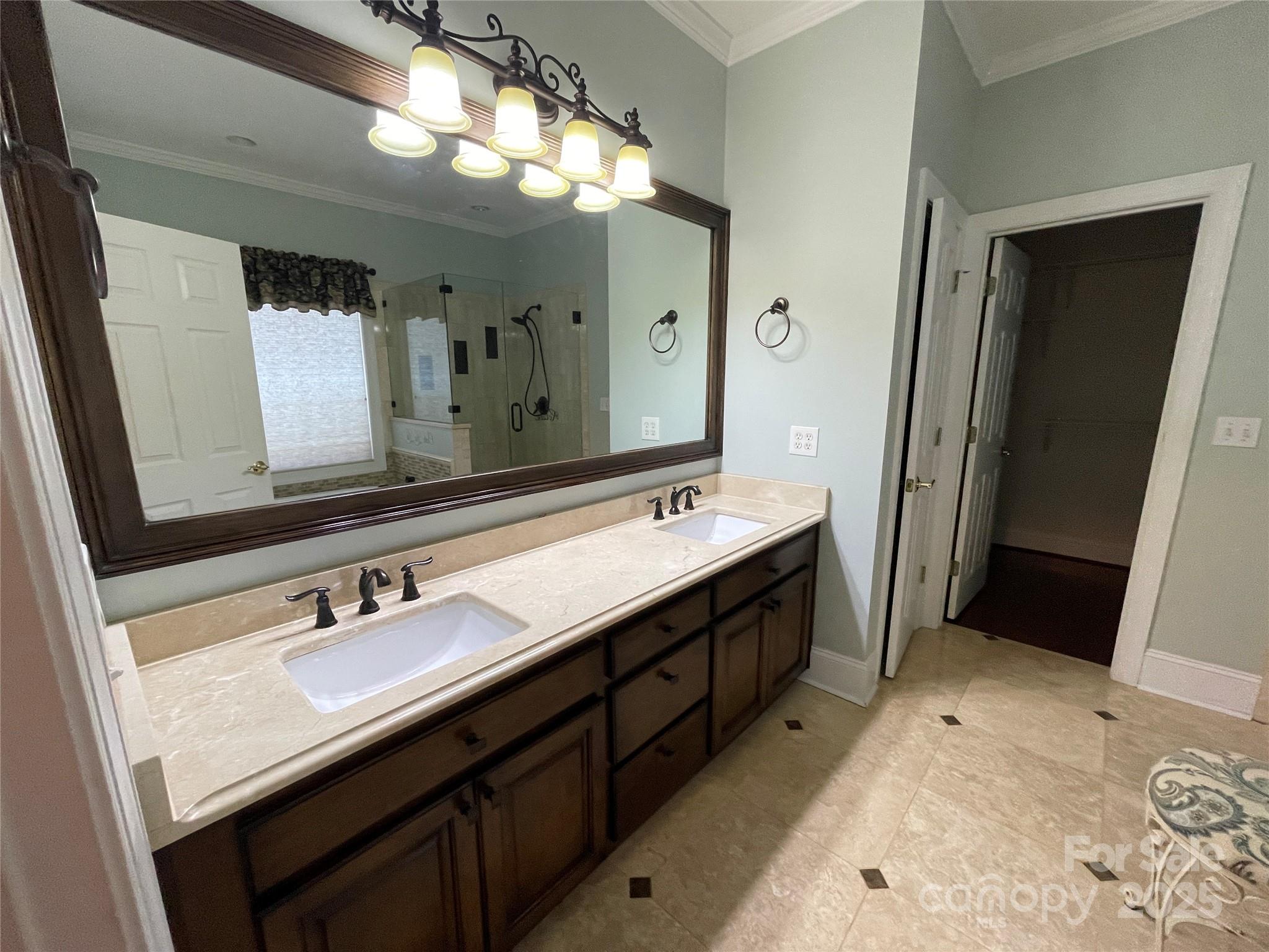 103 Berea Baptist Church Road Stanfield, NC 28163 - Photo 27 of 46 a bathroom with a double vanity sink and a mirror