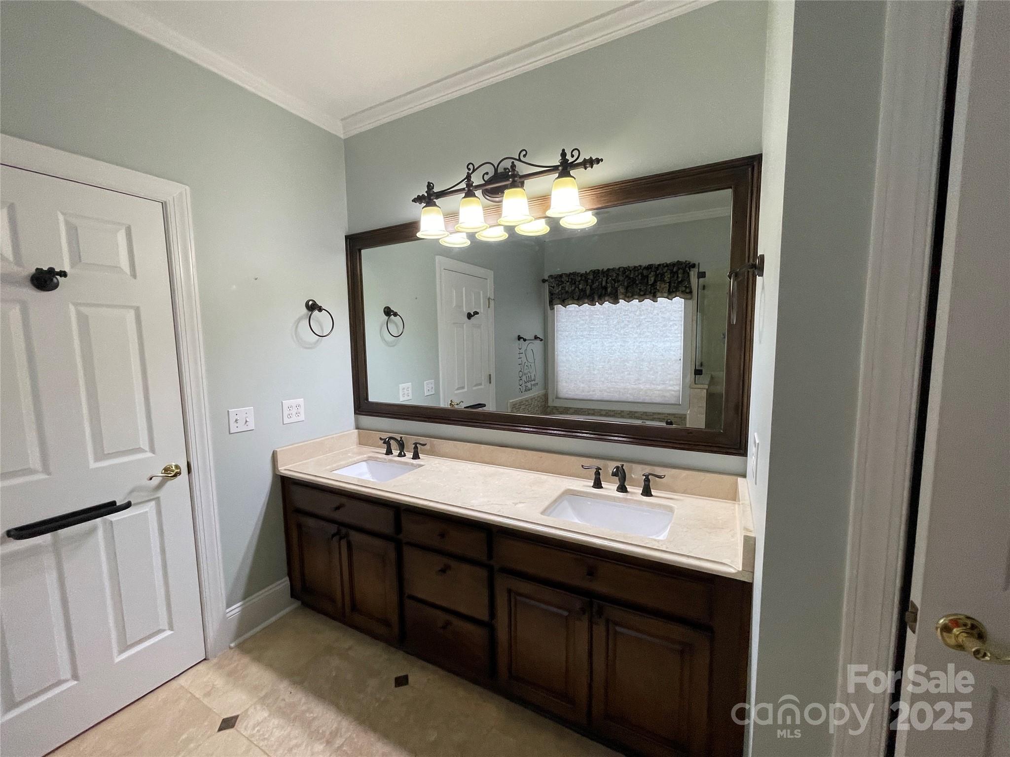 103 Berea Baptist Church Road Stanfield, NC 28163 - Photo 29 of 46 a bathroom with a double vanity sink and a mirror