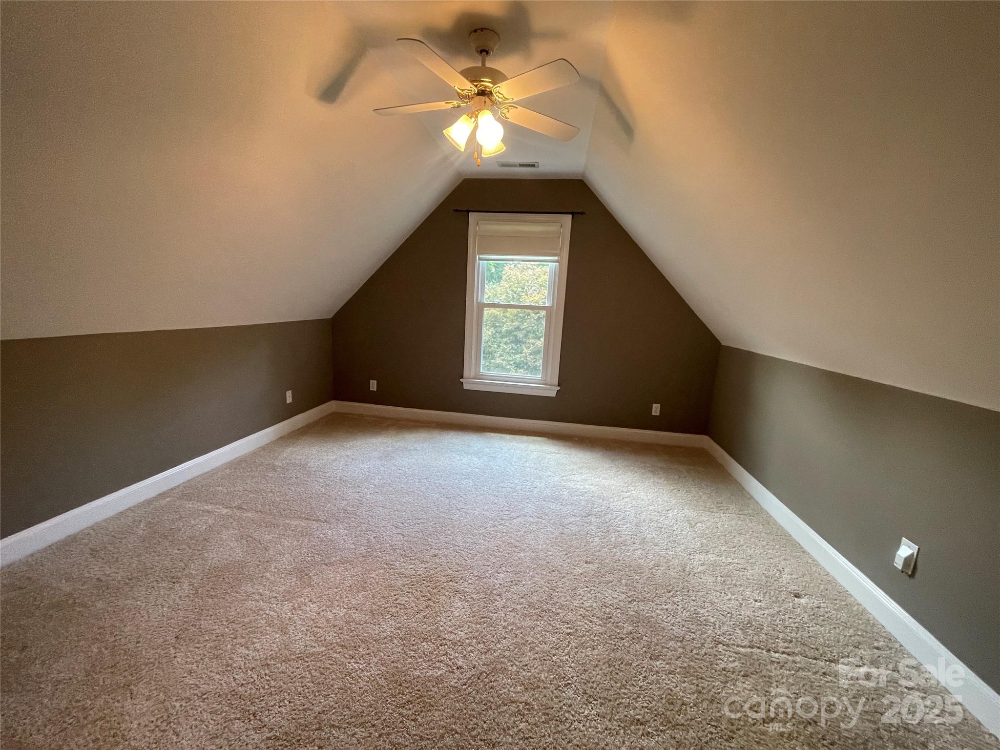 103 Berea Baptist Church Road Stanfield, NC 28163 - Photo 31 of 46 a view of a big room with windows and chandelier fan