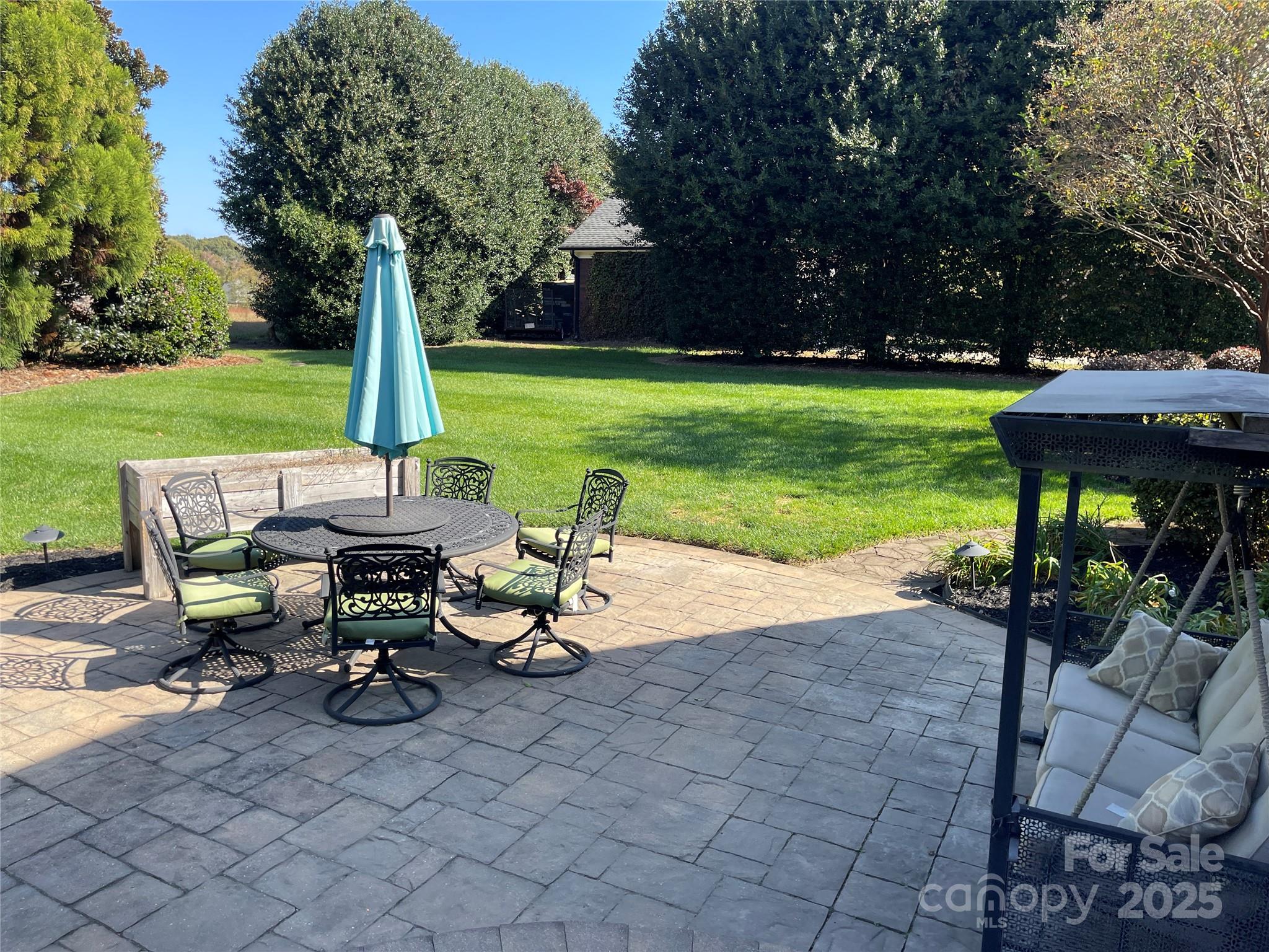 103 Berea Baptist Church Road Stanfield, NC 28163 - Photo 43 of 46 a view of a backyard with sitting area