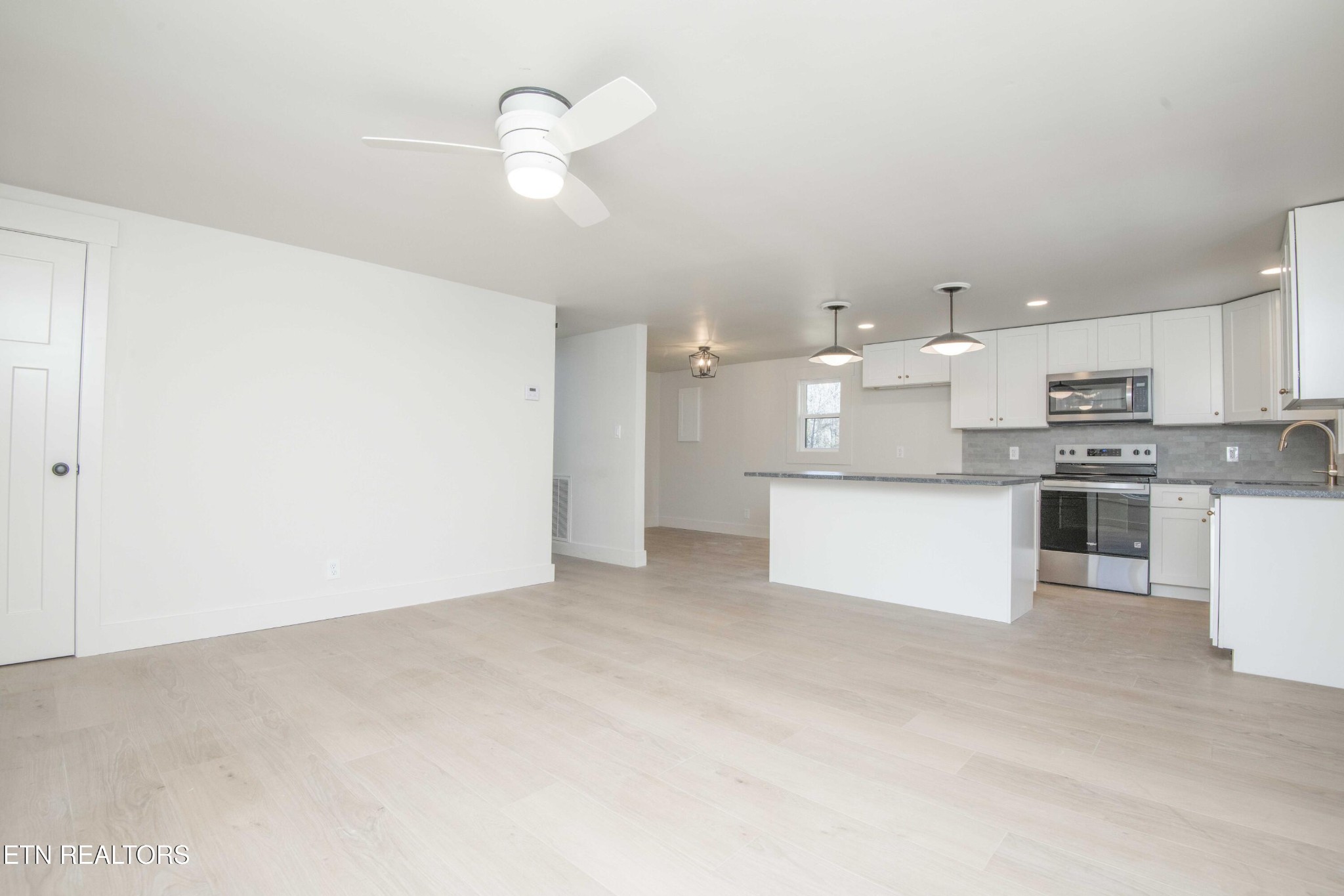 6223 Babelay Road Knoxville, TN 37924 - Photo 16 of 53 a view of kitchen with kitchen island white cabinets and stainless steel appliances