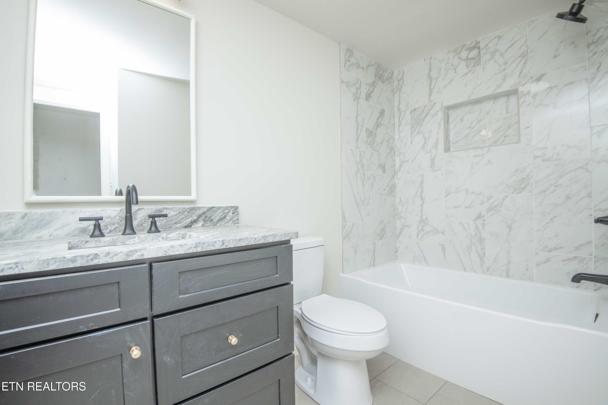6223 Babelay Road Knoxville, TN 37924 - Photo 31 of 53 a bathroom with a granite countertop sink toilet and bathtub