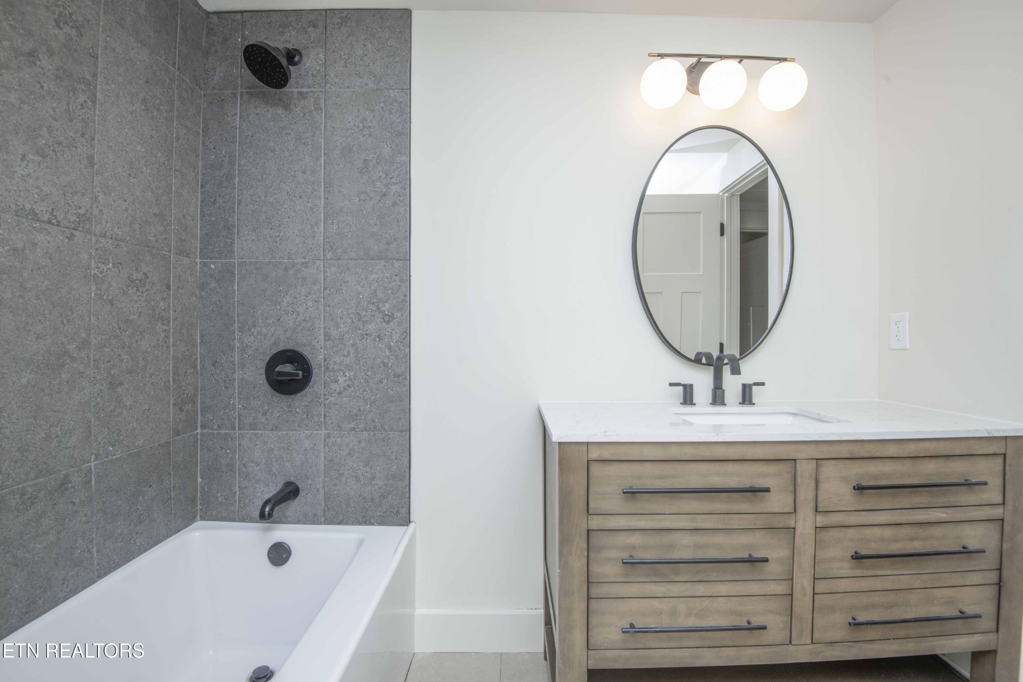 6223 Babelay Road Knoxville, TN 37924 - Photo 34 of 53 a bathroom with a sink a vanity and mirror