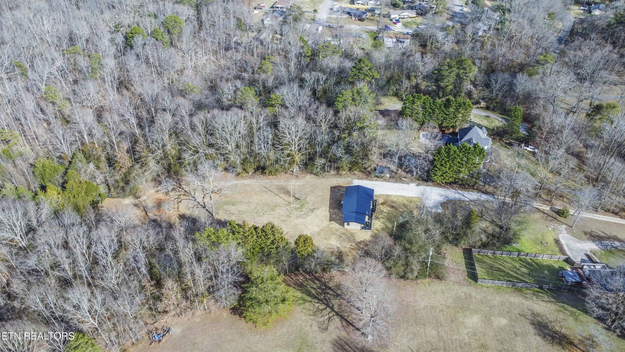 6223 Babelay Road Knoxville, TN 37924 - Photo 6 of 53 a view of a dry yard with trees
