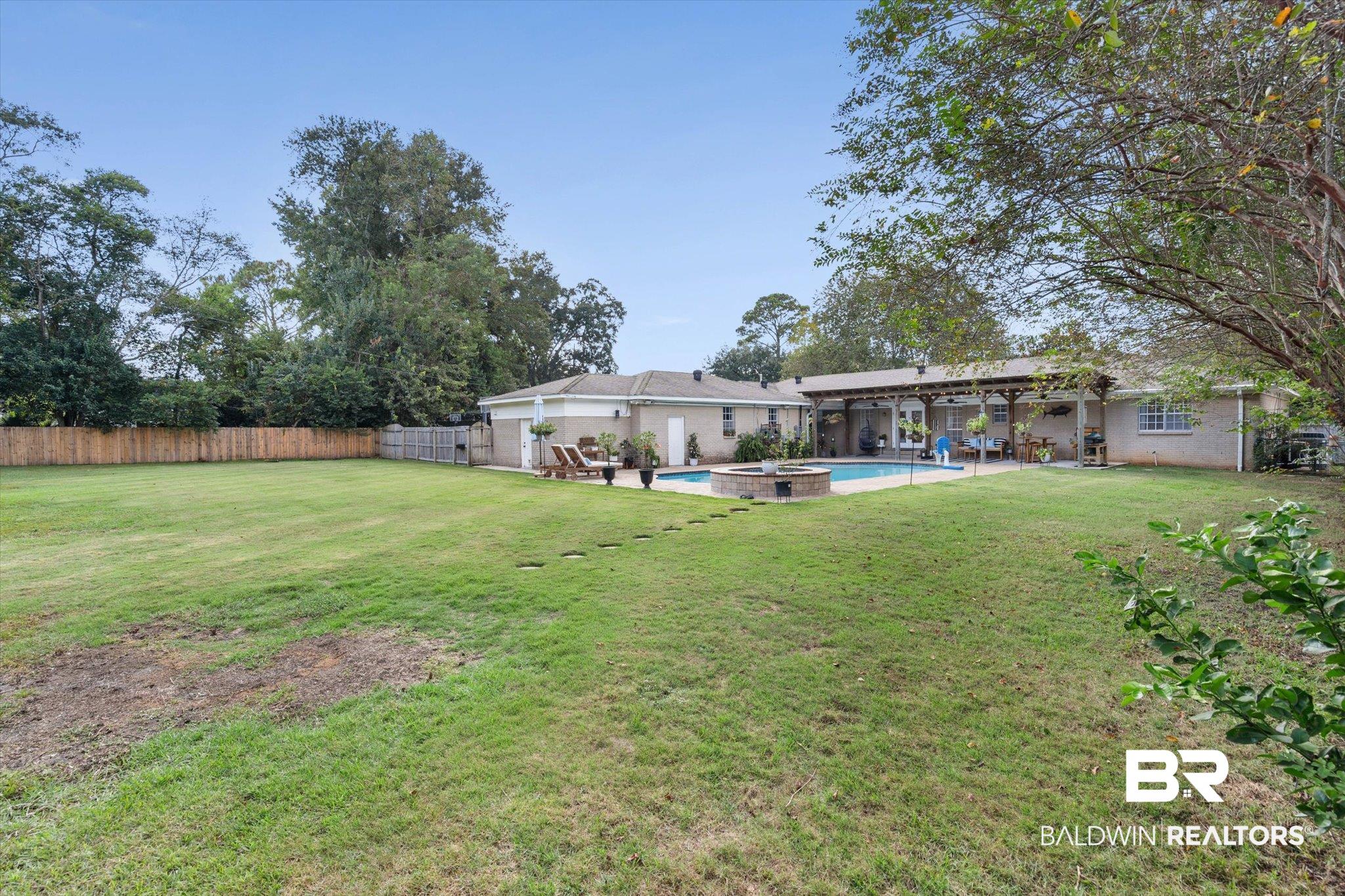 254 Woodlands Avenue Mobile, AL 36607 - Photo 38 of 50 Rear view of property featuring a patio and a fenced backyard