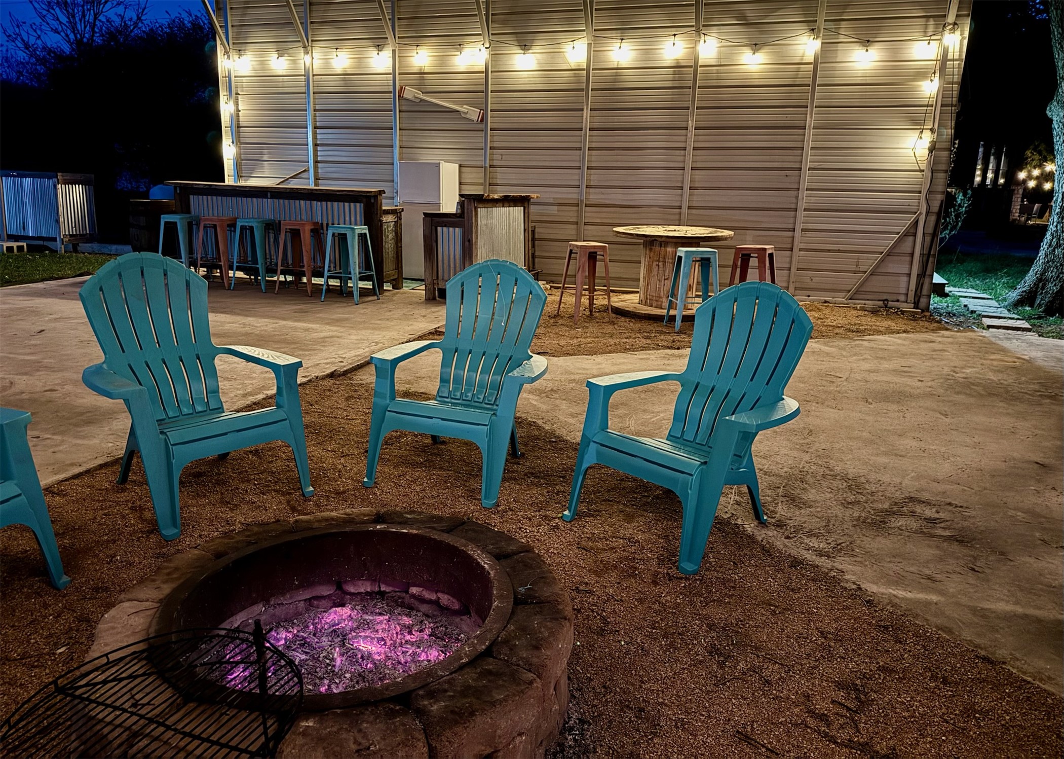 View of patio featuring a fire pit
