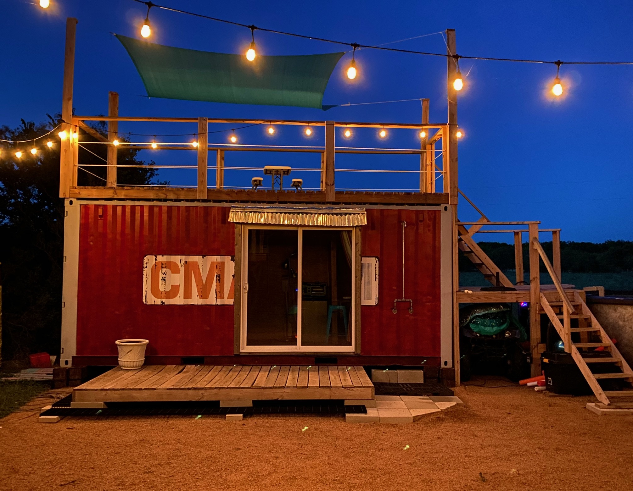 1512 River Grove Road, Unit A Kingsbury, TX 78638 - Photo 28 of 35 Back of house at night featuring a wooden deck