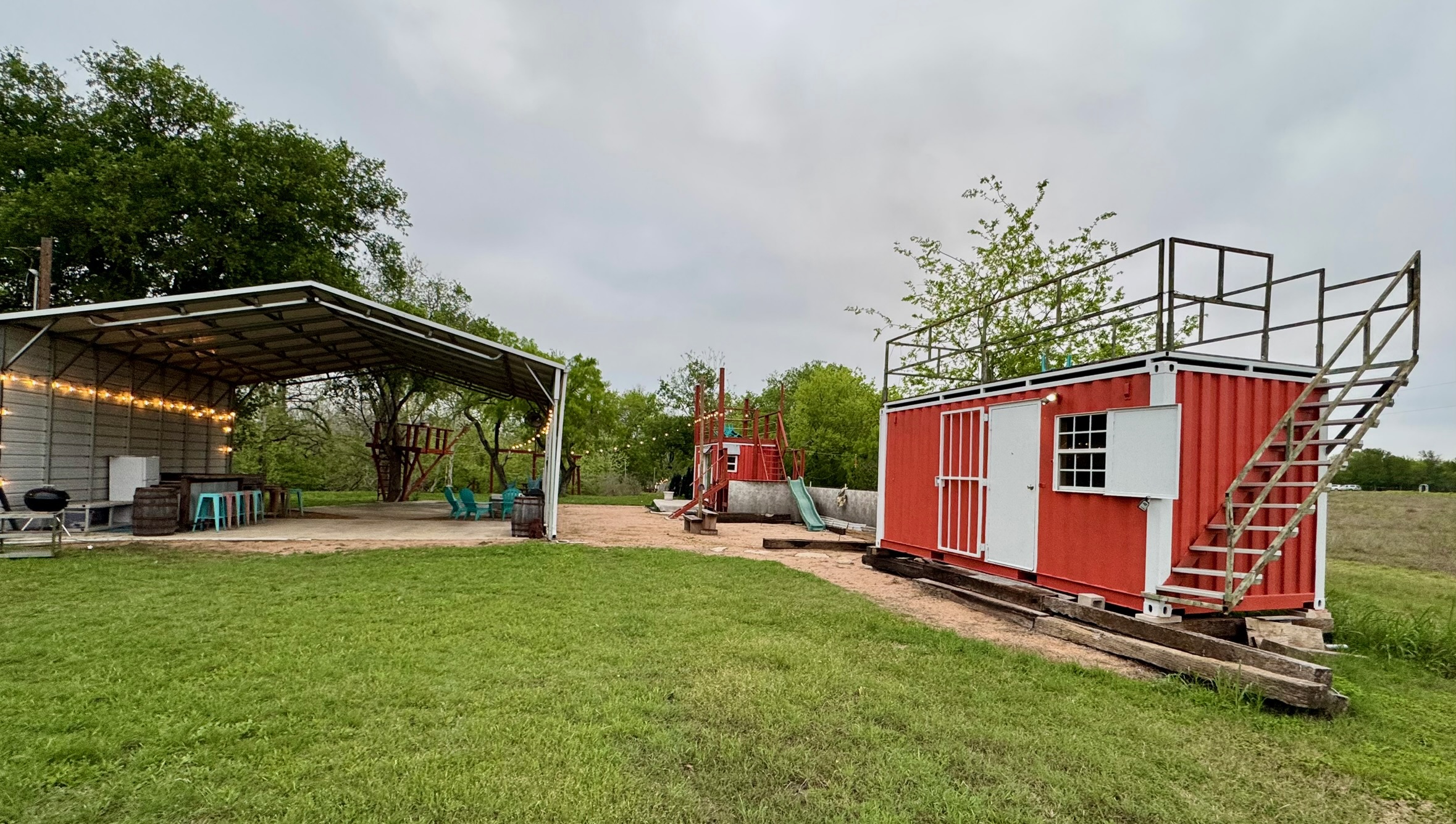 1512 River Grove Road, Unit A Kingsbury, TX 78638 - Photo 10 of 35 View of grassy yard with a playground, a patio area, and a storage shed