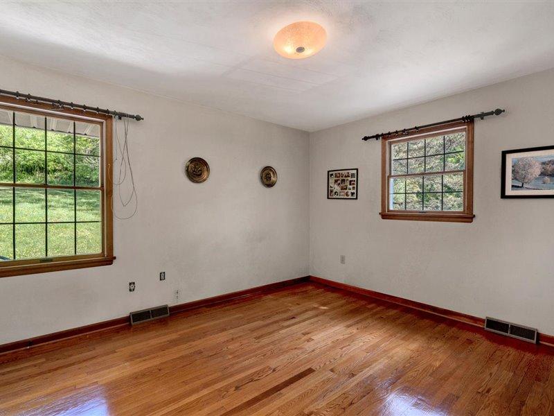 249 Zimmerman Road Blue Ridge, VA 24064 - Photo 21 of 33 a view of a room with wooden floor and window