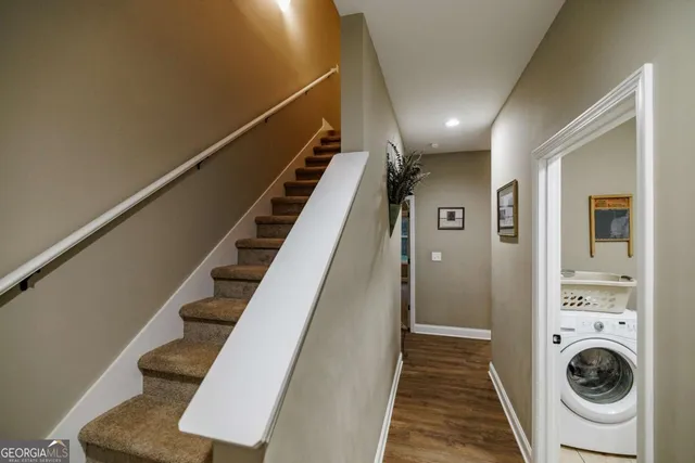 a bedroom with a bed and a lamp