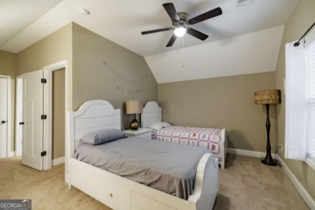 a living room with furniture and a lamp