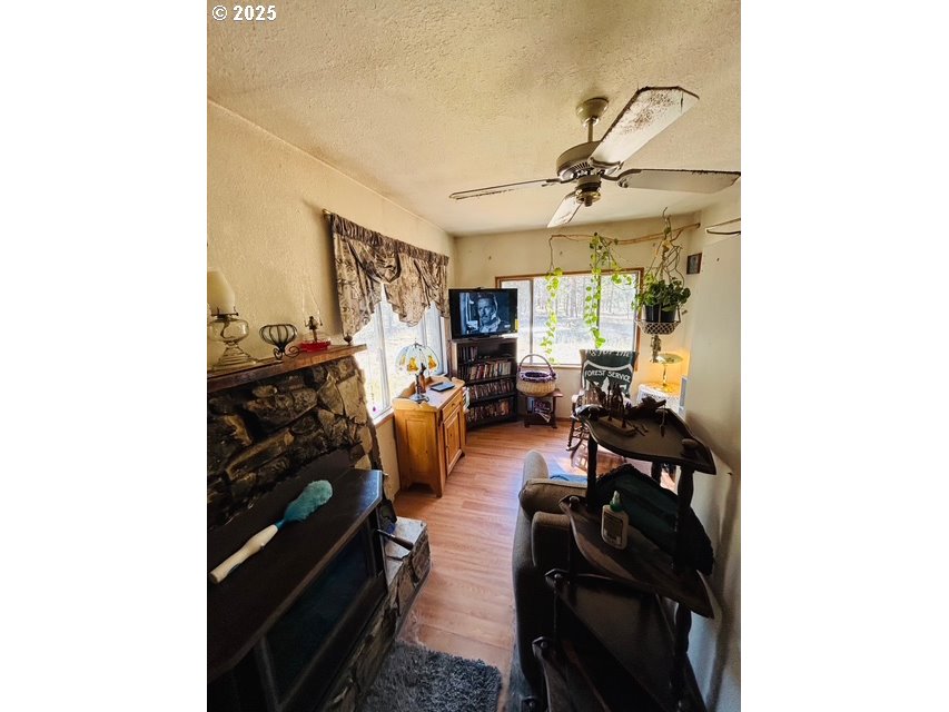 52205 Lechner Lane La Pine, OR 97739 - Photo 12 of 14 a living room with furniture and a chandelier