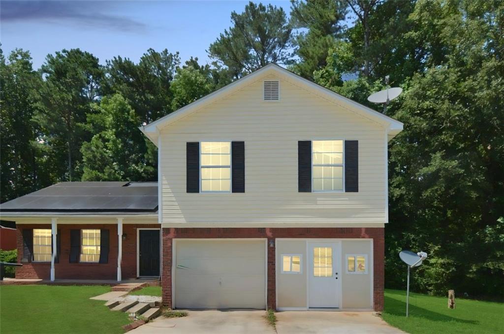 2172 Cold Springs Circle Lithonia, GA 30058 - Photo 1 of 1 a front view of a house with garden