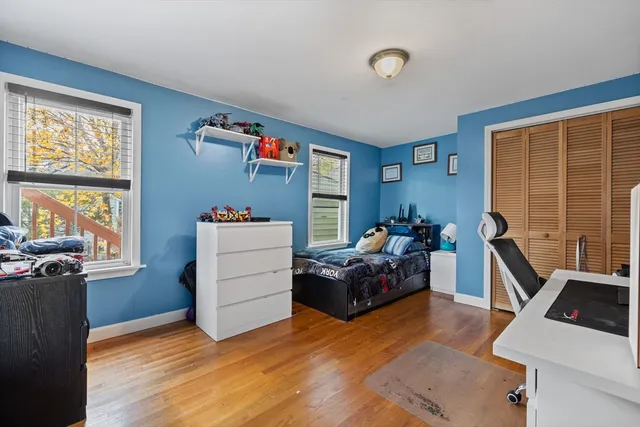 a bedroom with furniture and a window