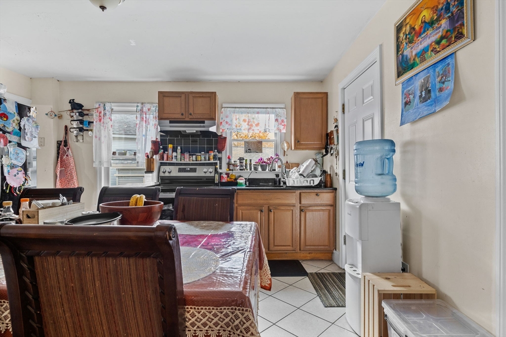 33 Chestnut Street Milford, MA 01757 - Photo 14 of 41 a room with furniture a flat screen tv and a window