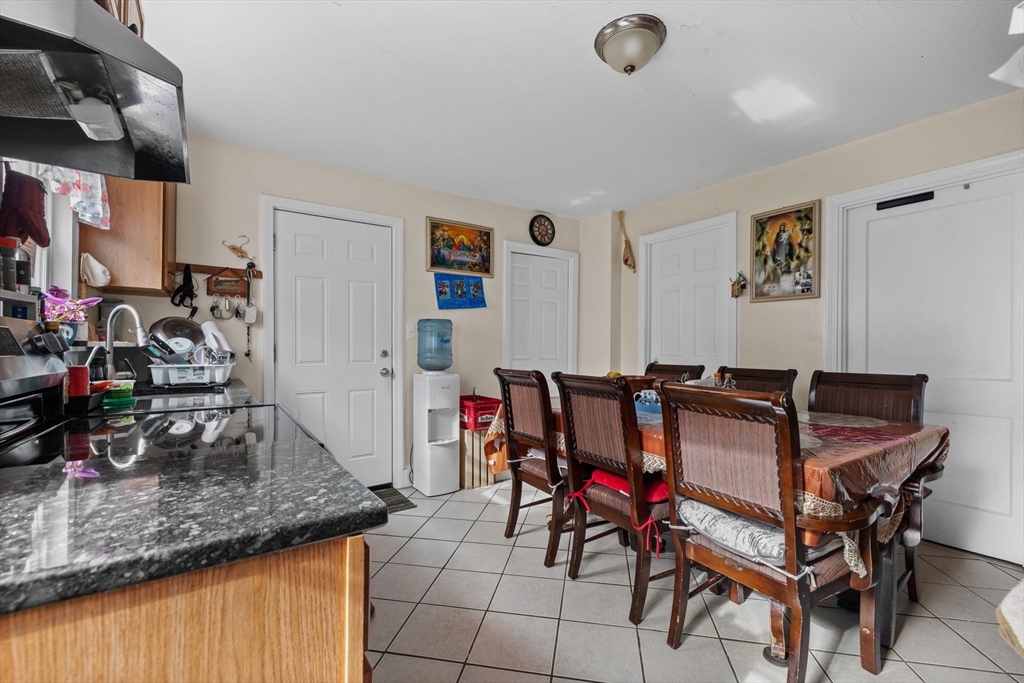 33 Chestnut Street Milford, MA 01757 - Photo 17 of 41 a view of a dining room with furniture and a kitchen