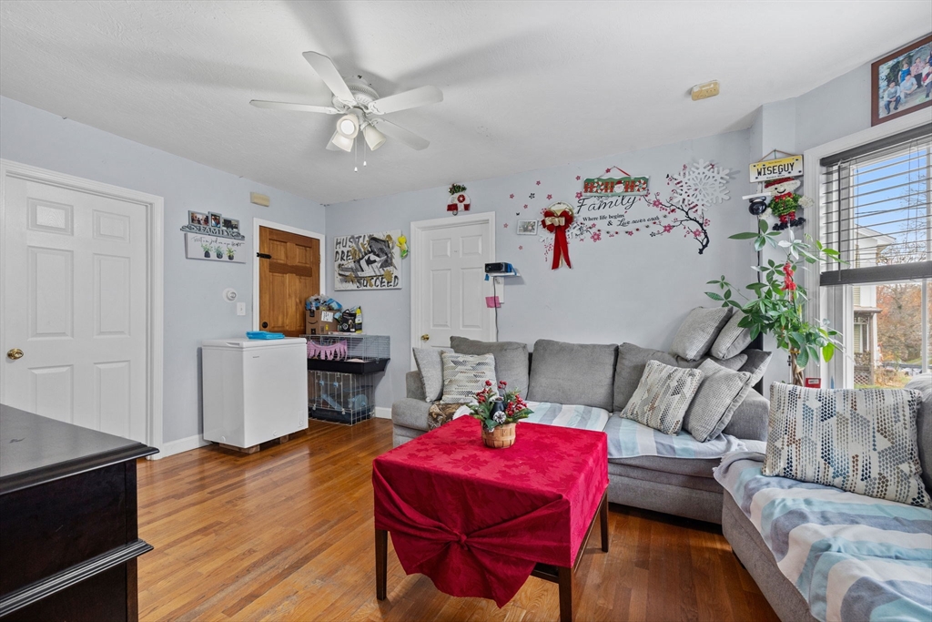 33 Chestnut Street Milford, MA 01757 - Photo 18 of 41 a living room with furniture and wooden floor