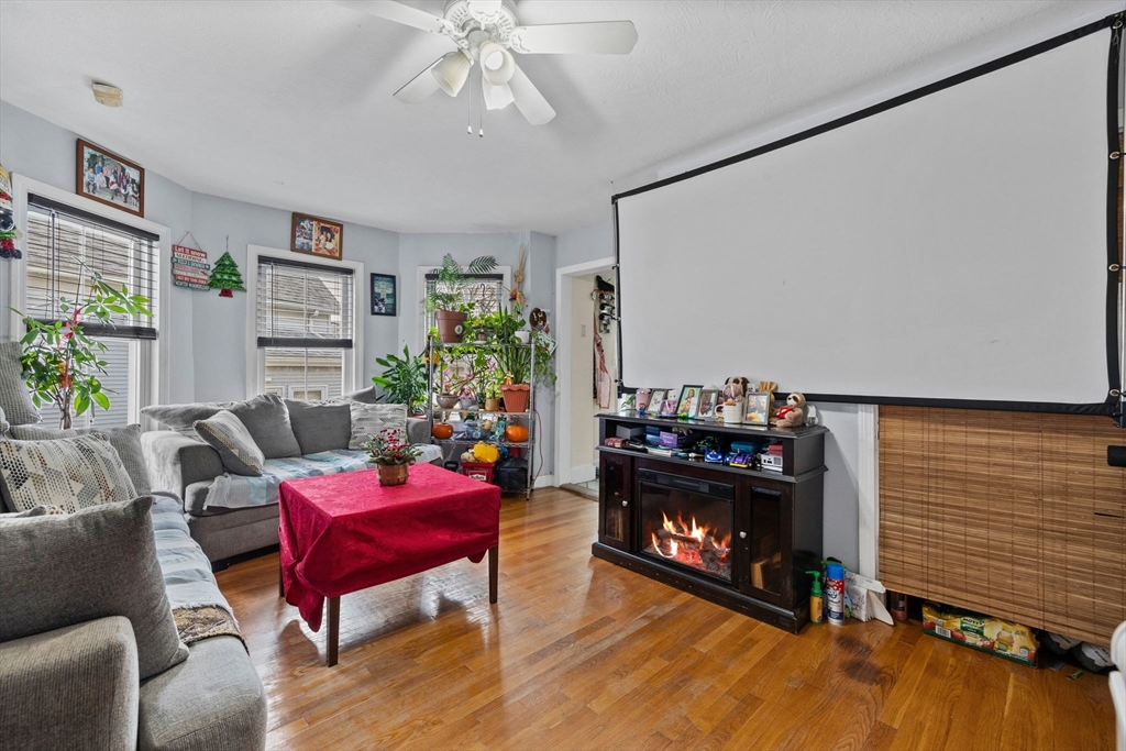 33 Chestnut Street Milford, MA 01757 - Photo 19 of 41 a living room with furniture and a fireplace
