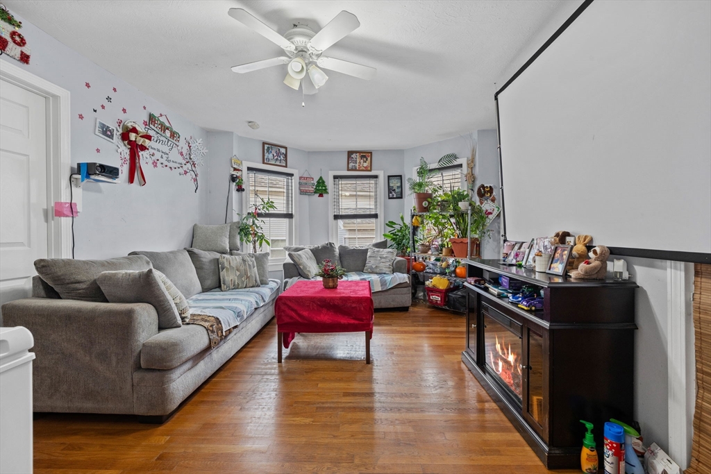 33 Chestnut Street Milford, MA 01757 - Photo 20 of 41 a living room with furniture and wooden floor