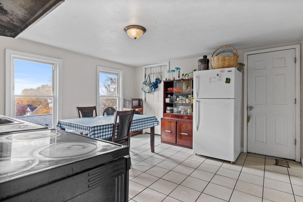 33 Chestnut Street Milford, MA 01757 - Photo 22 of 41 a living room with furniture and a dining table