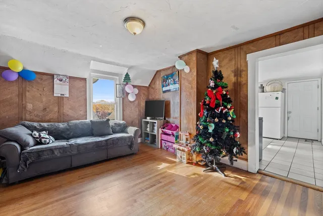 a living room with furniture and flowers