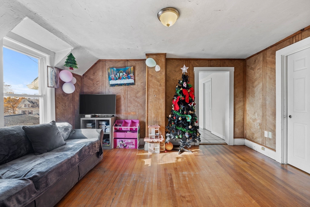 33 Chestnut Street Milford, MA 01757 - Photo 24 of 41 a living room with furniture and a flat screen tv
