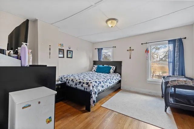 a bedroom with a bed and a couch