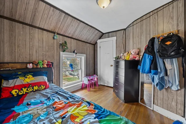 a bedroom with furniture and a baby crib