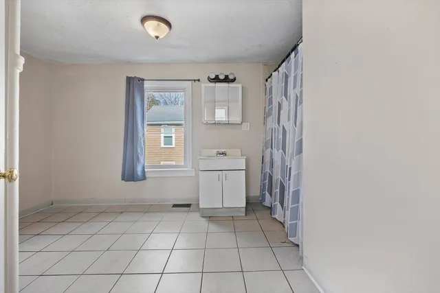 a view of a storage & utility room in back yard