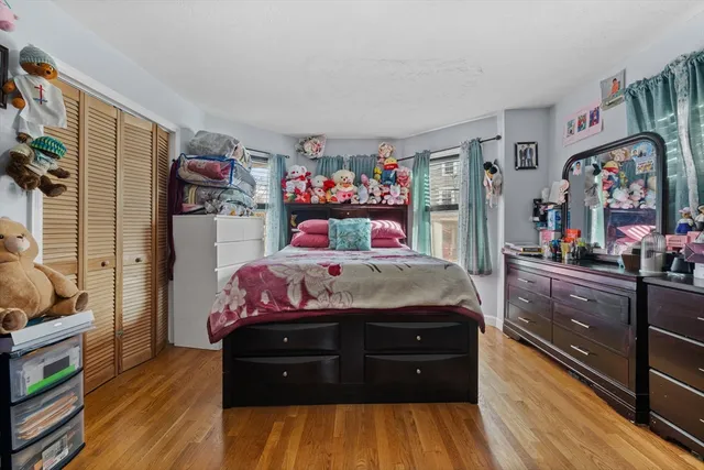 a bed room with a bed and a dresser