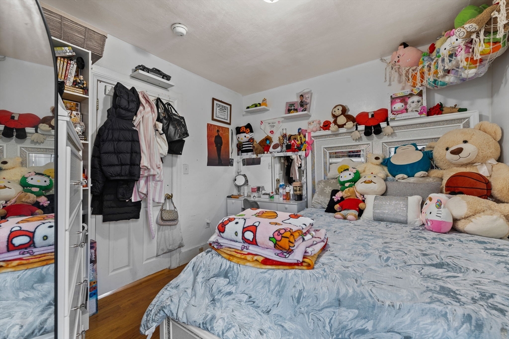 33 Chestnut Street Milford, MA 01757 - Photo 8 of 41 a bedroom with toys and a bed