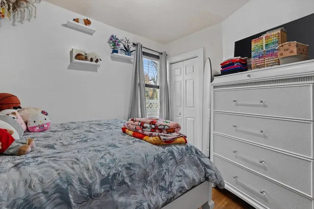 a bedroom with a bed and cabinets